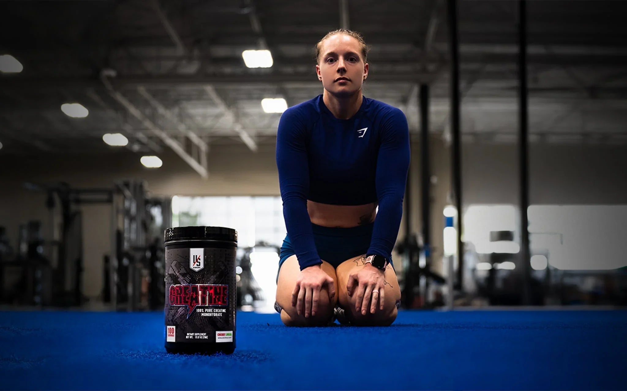 Die Tryin Co Athlete in gymnasium with creatine