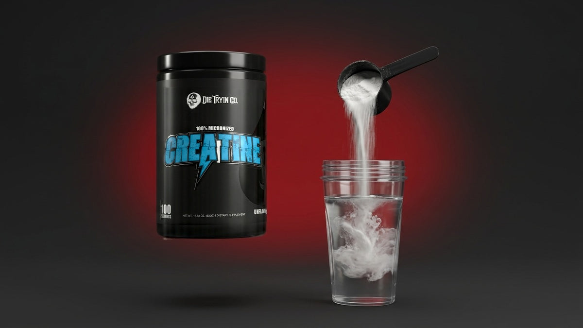 Scoop of creatine monohydrate pouring into a glass of water beside a Die Tryin Co. Unflavored Creatine tub