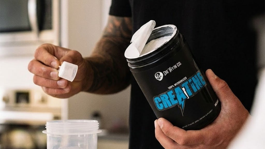 Die Tryin Co Micronized Creatine Monohydrate being scrooped into cup
