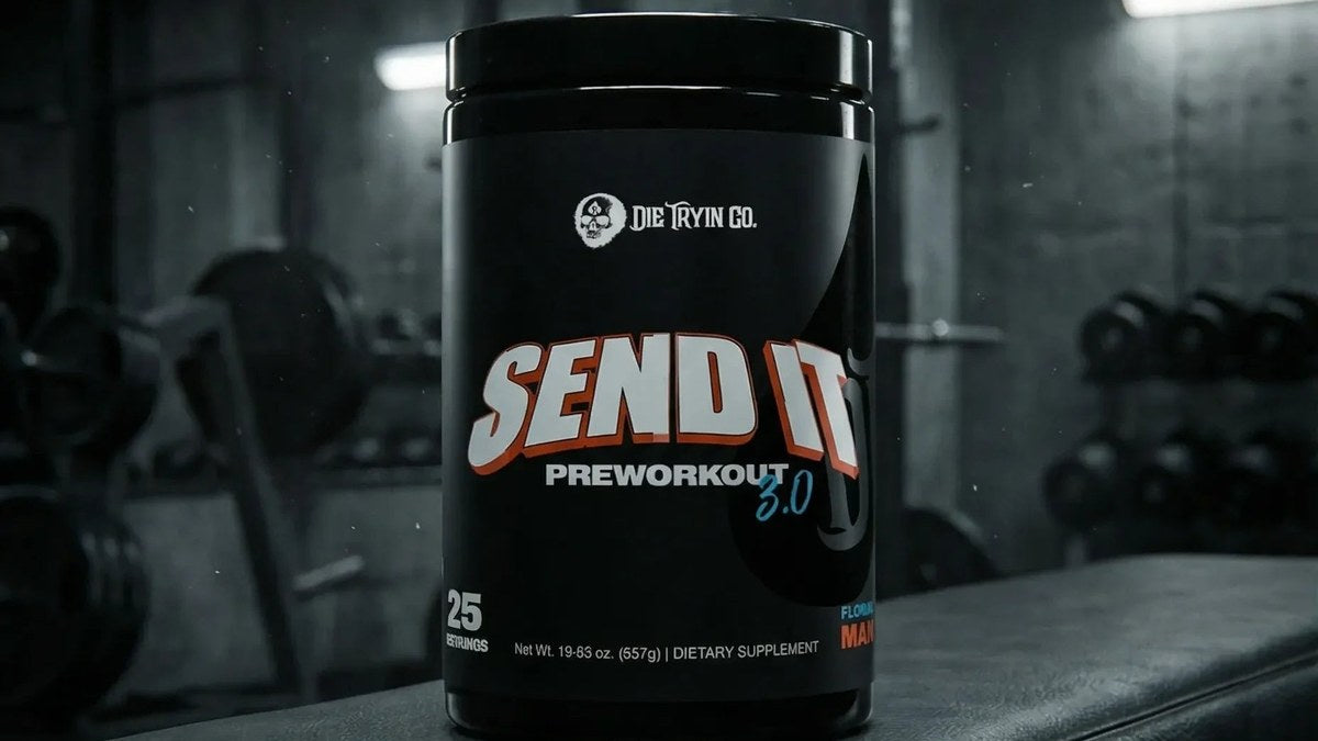 Black container of SEND IT V3 supplement on a weight bench in a gym.