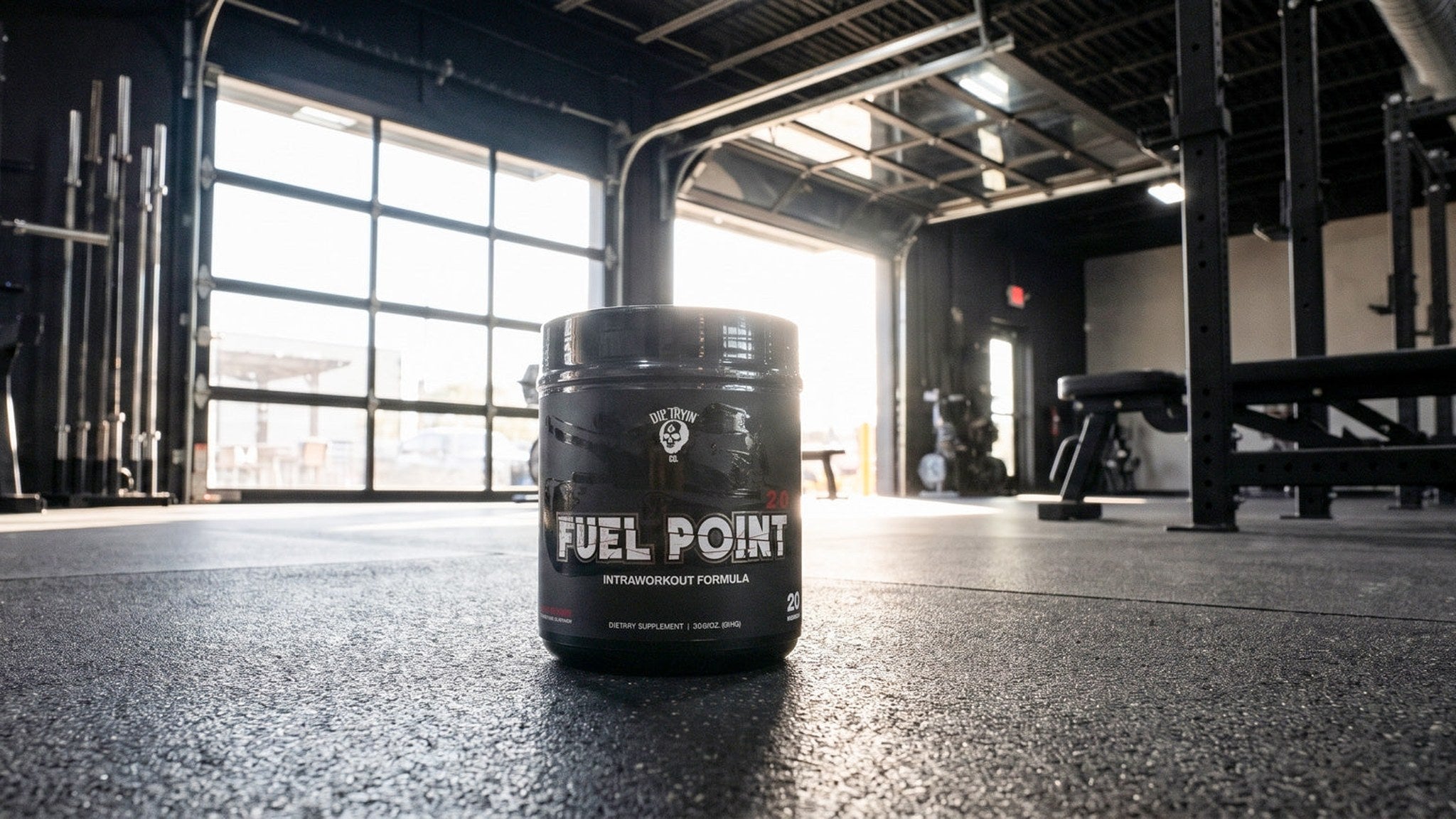 Fuel Point 2.0 intra-workout tub on the floor of an open garage-door training gym