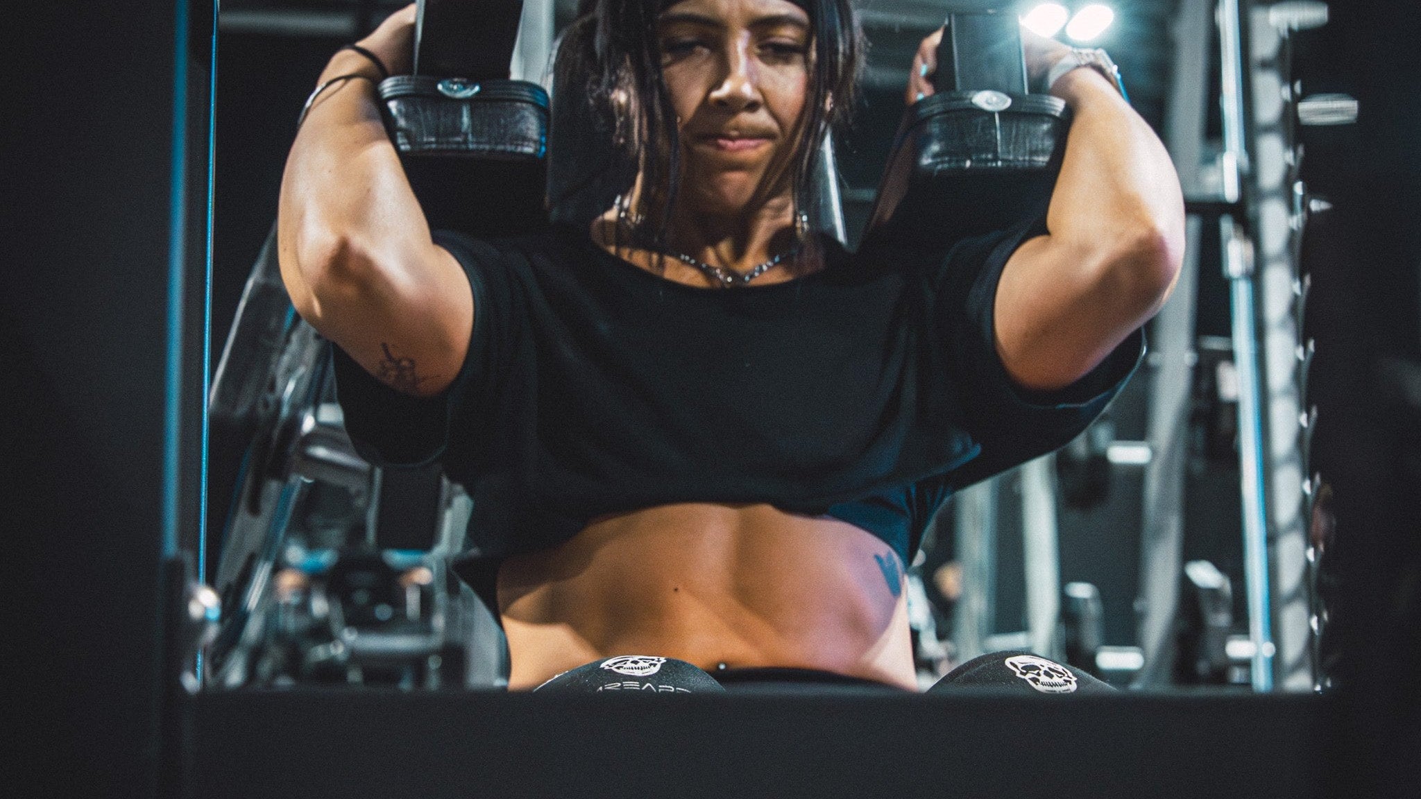 Athlete grinding through a weighted squat in a power rack