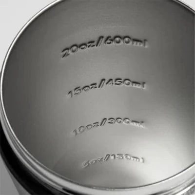 Inside of a stainless steel shaker cup with embossed measurement lines from 5 oz to 20 oz