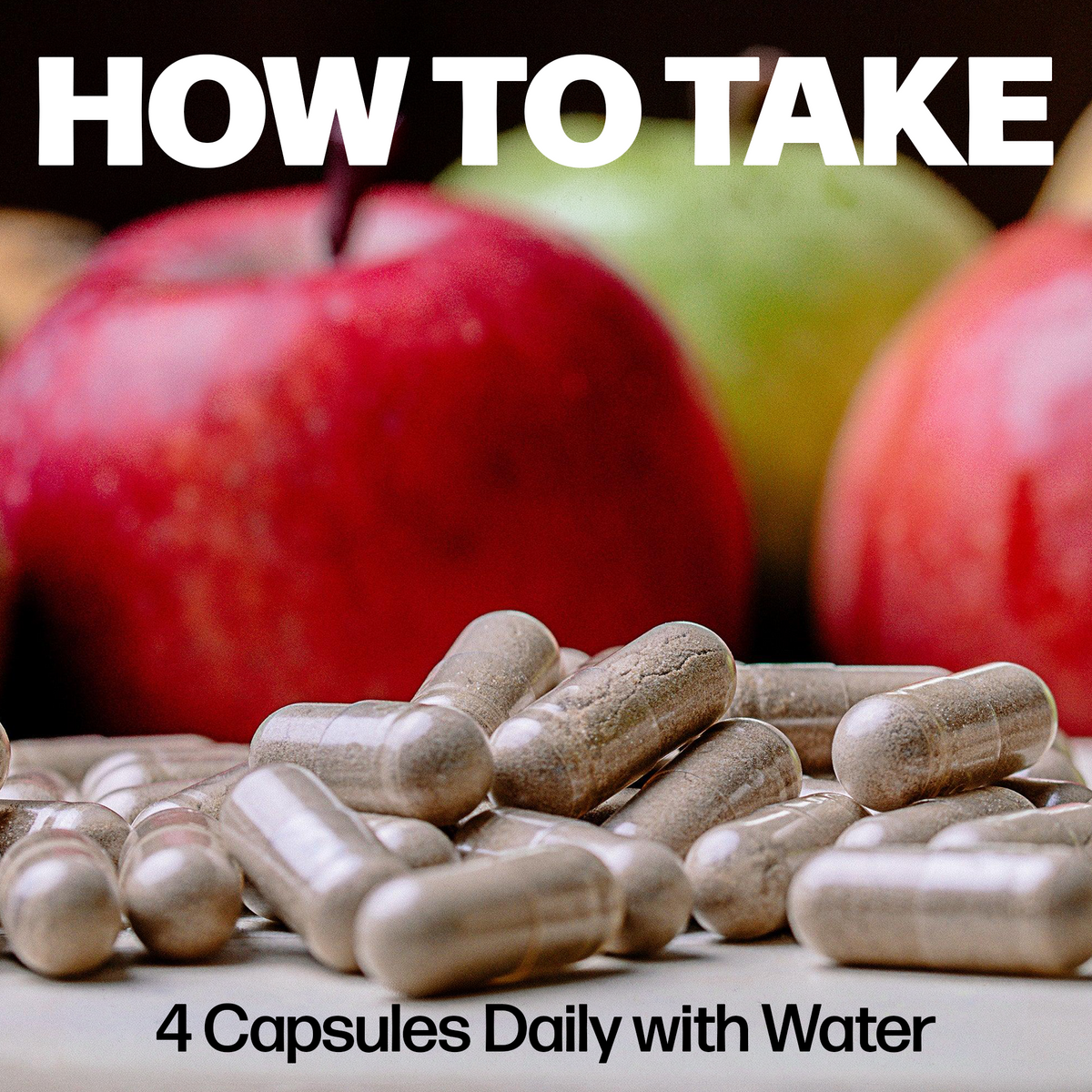 How to take Daily Essentials: 4 capsules daily with water, shown with fresh apples