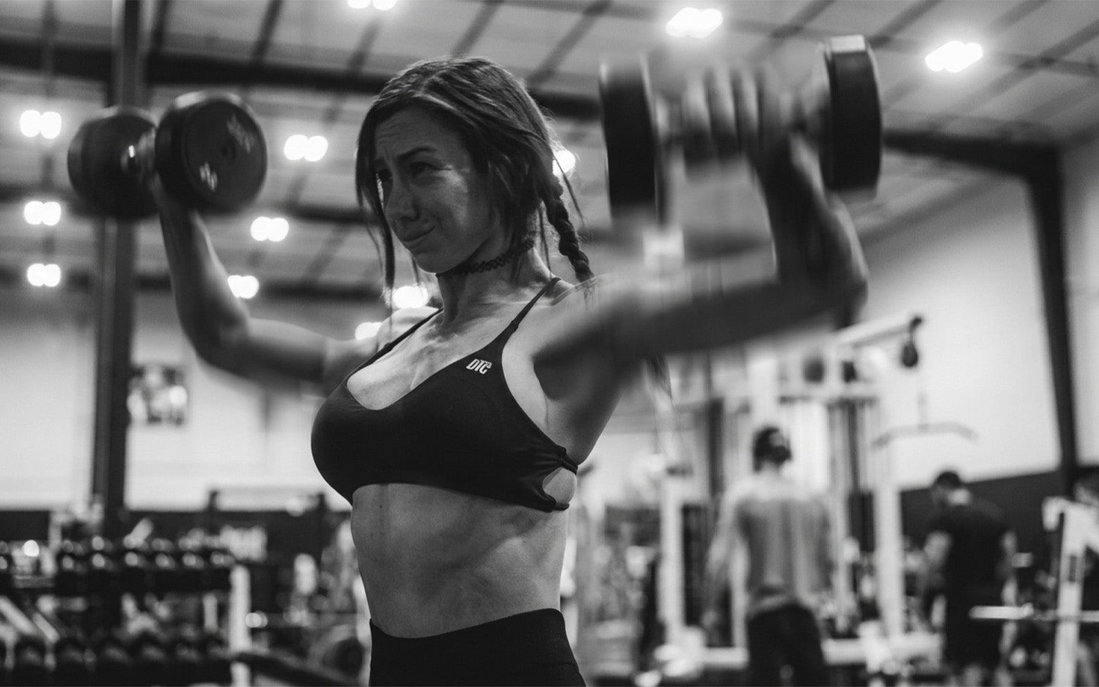 Lifter pushing through a set under heavy load — silencing weakness through action