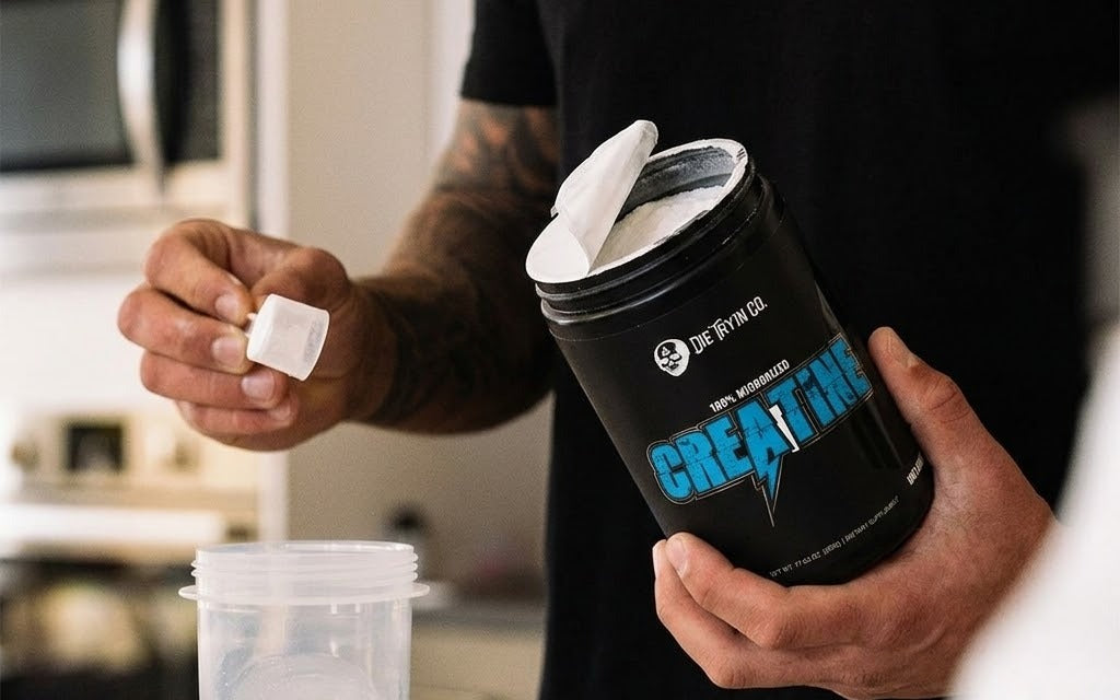 Die Tryin Co Micronized Creatine Monohydrate being scrooped into cup