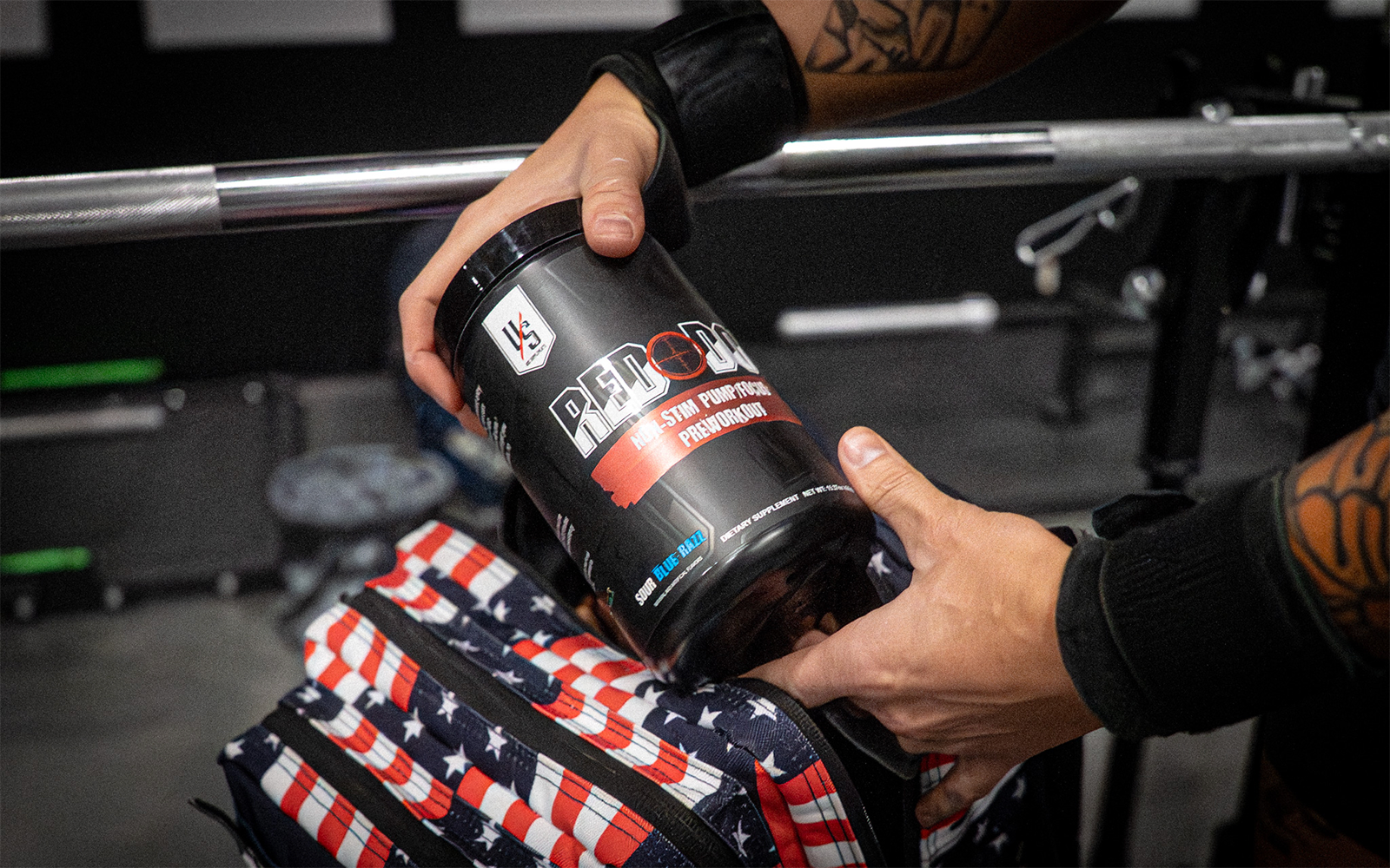 Red Dot pre-workout powder handled by Die Tryin Co Athlete