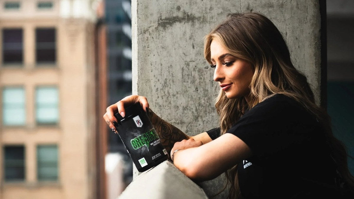 Athlete holding Die Tryin Co Micronized Creatine Monohydrate