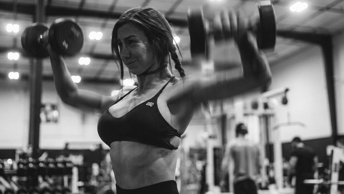 Lifter pushing through a set under heavy load — silencing weakness through action