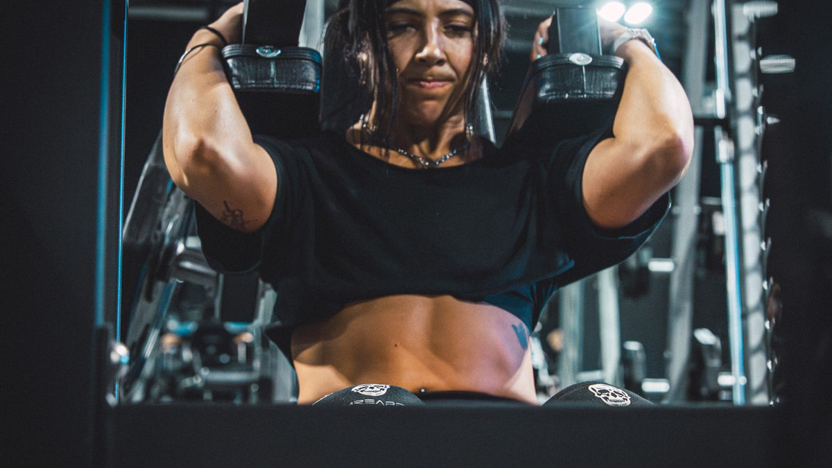 Athlete grinding through a weighted squat in a power rack