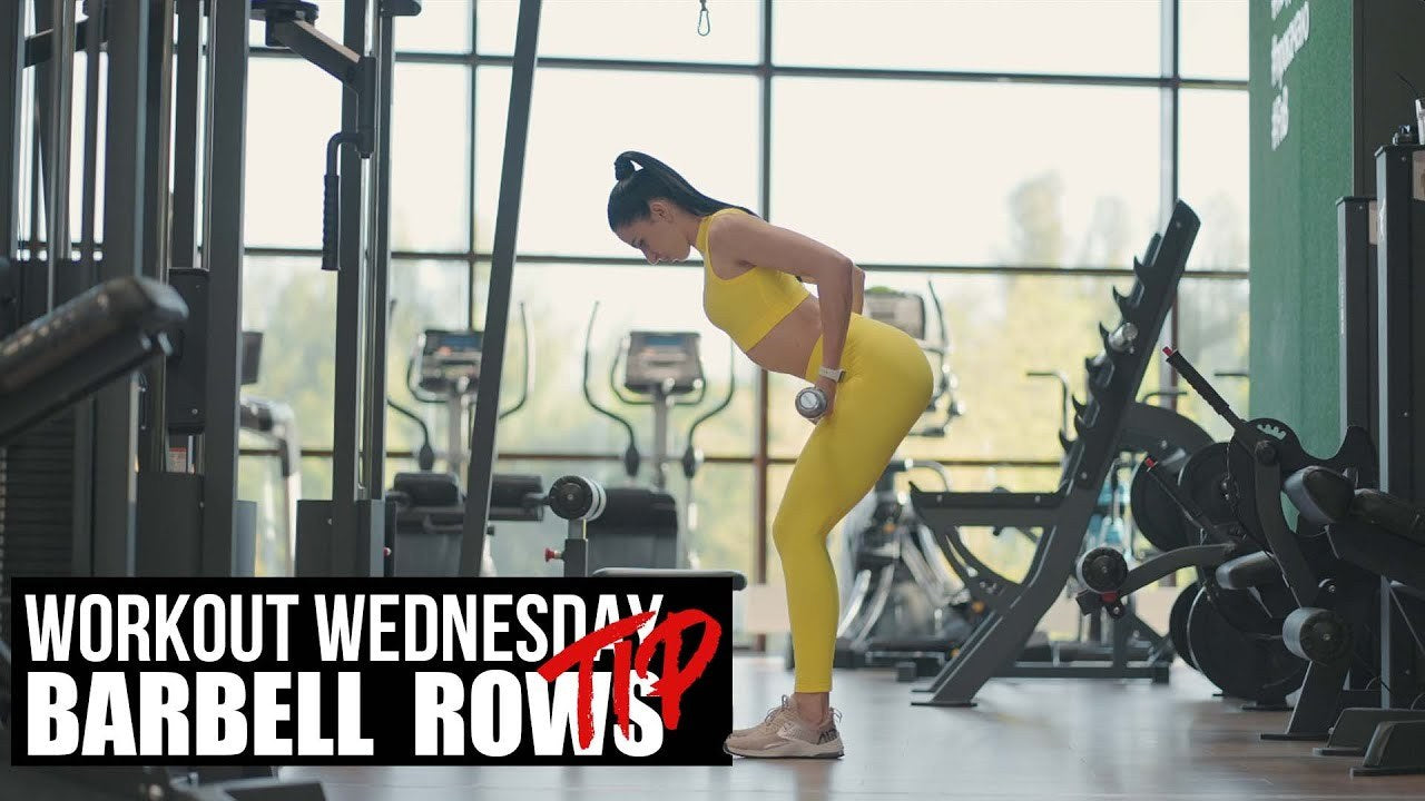 Workout Wednesday barbell rows tip video cover, athlete at the dumbbell rack