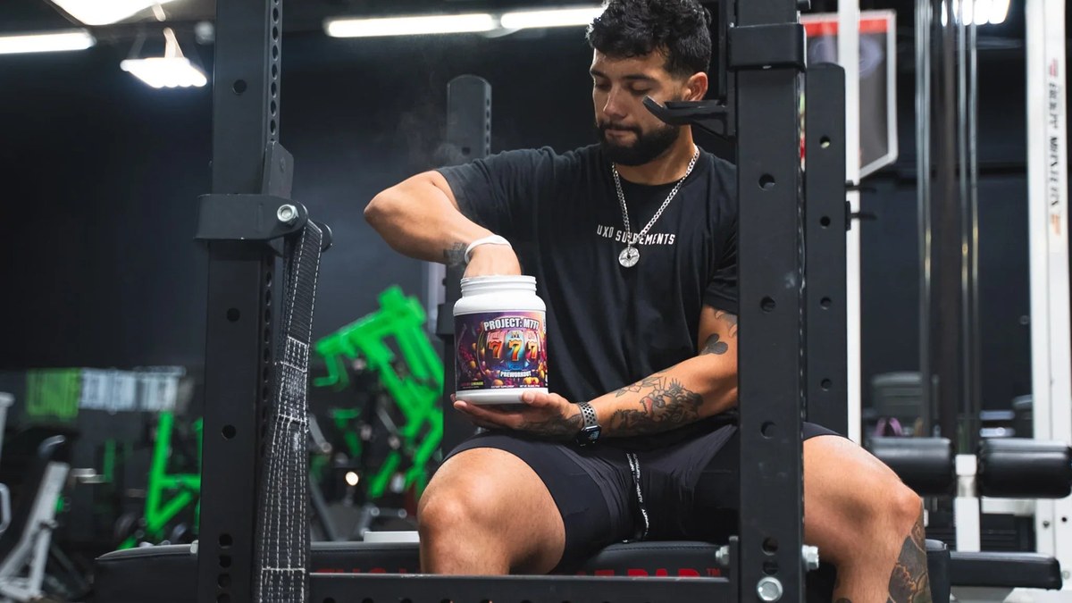 Pre-workout supplement scoop on gym counter — Die Tryin Co. Project M777