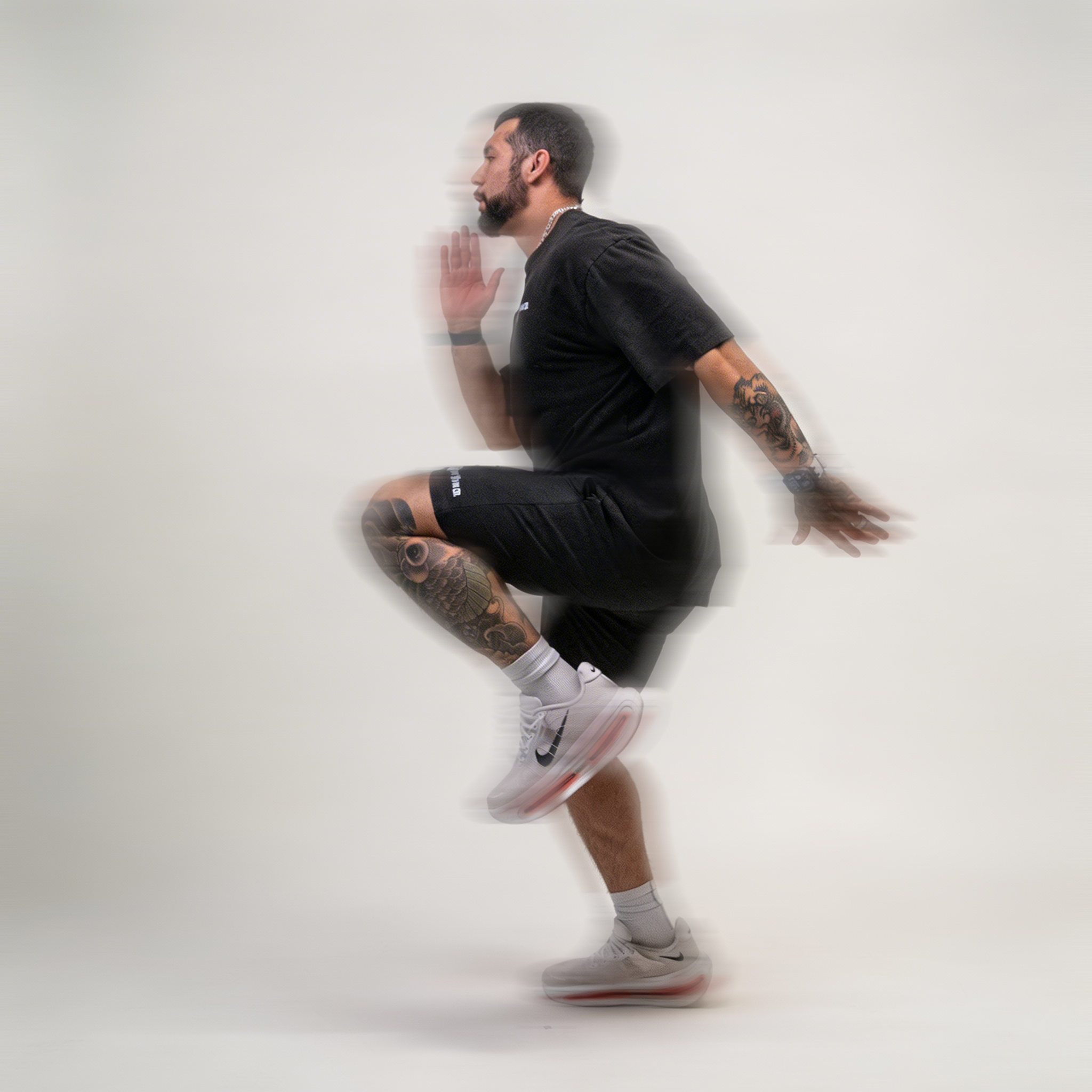 Athlete doing high knees in the Mens Performance shorts, motion shot