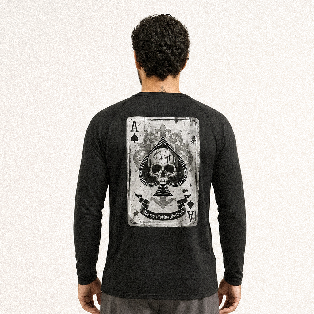 Back view of a man in a black long sleeve tee with an ace of spades skull card print
