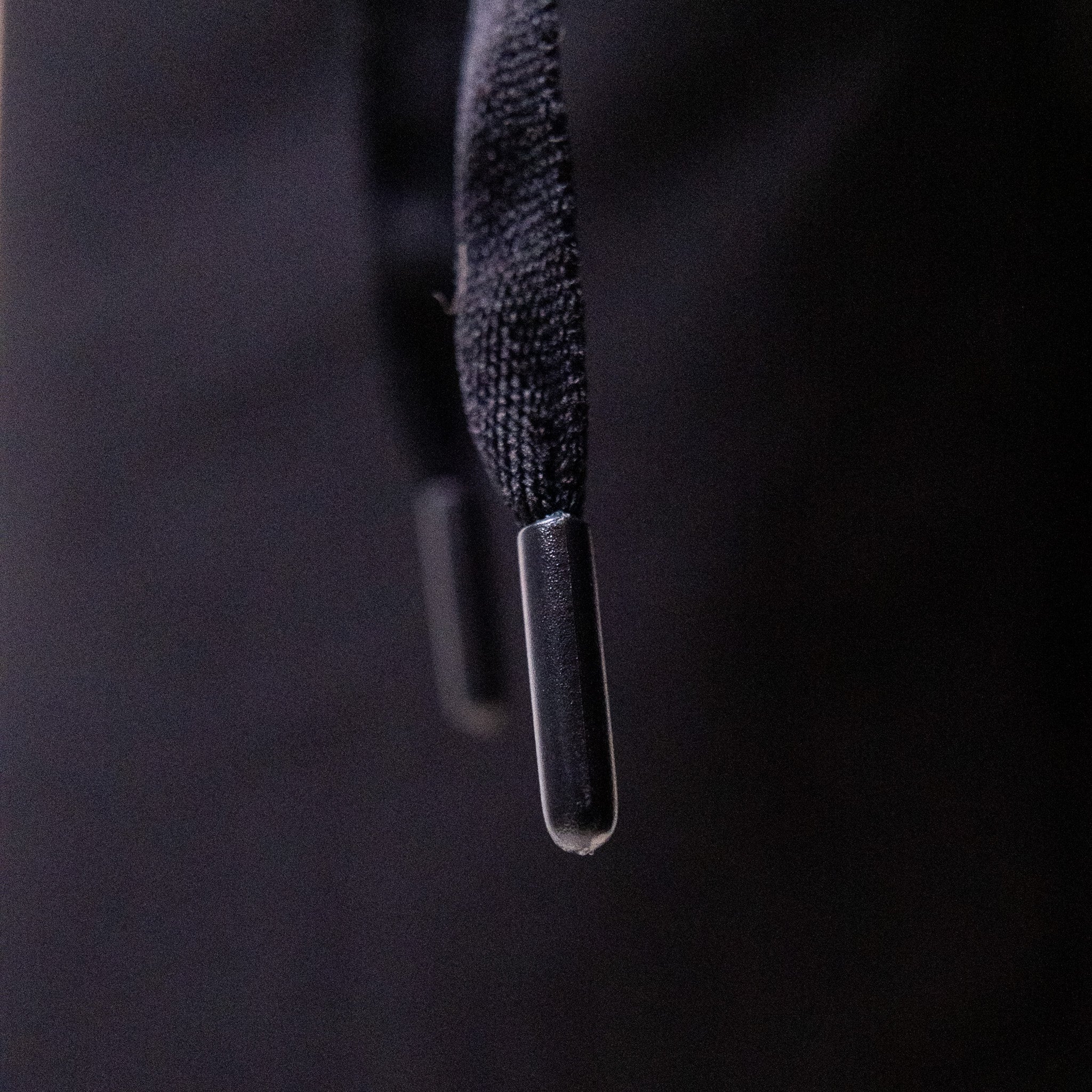Flat drawstring detail close-up on the Mens Performance shorts