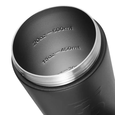 Open black stainless steel shaker bottle showing its threaded rim and embossed ounce and milliliter markings inside