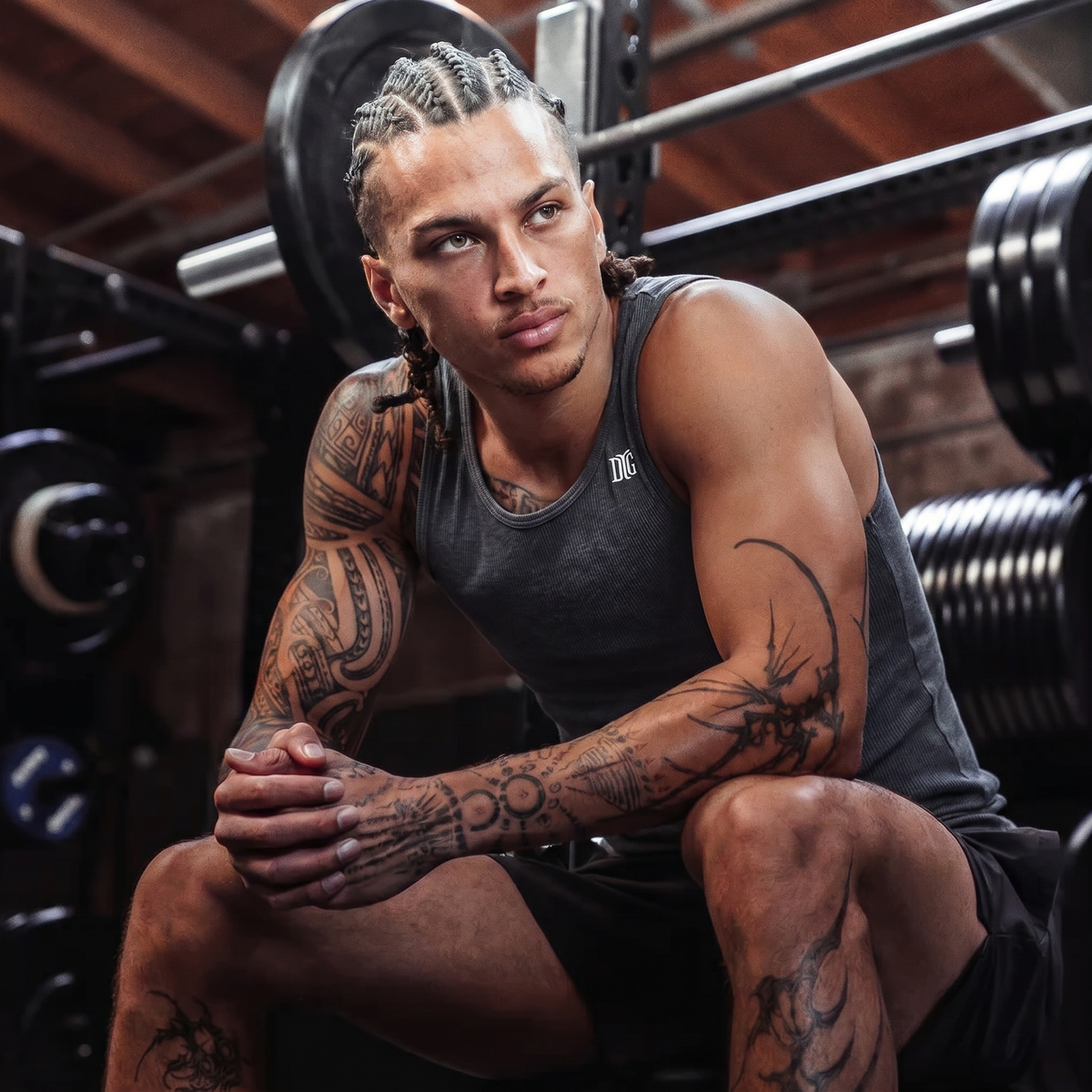 Athlete wearing the grey Beater tank in a gym
