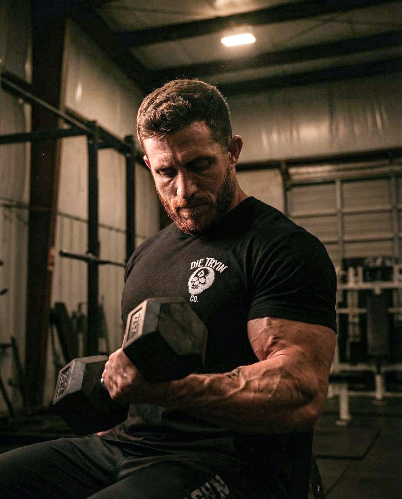Bomber Girl fitted tee worn during a dumbbell curl