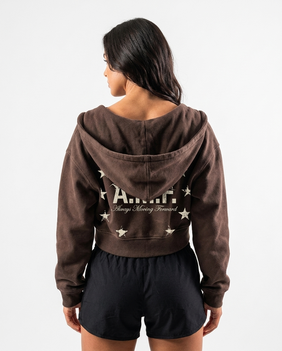 Back view of a brown cropped hoodie with a distressed A.M.F. Always Moving Forward print circled by stars