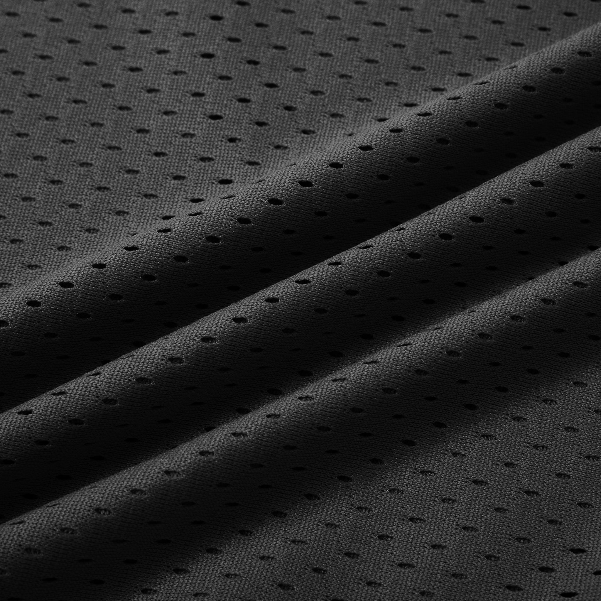 Close-up of the mesh fabric on the black training shorts
