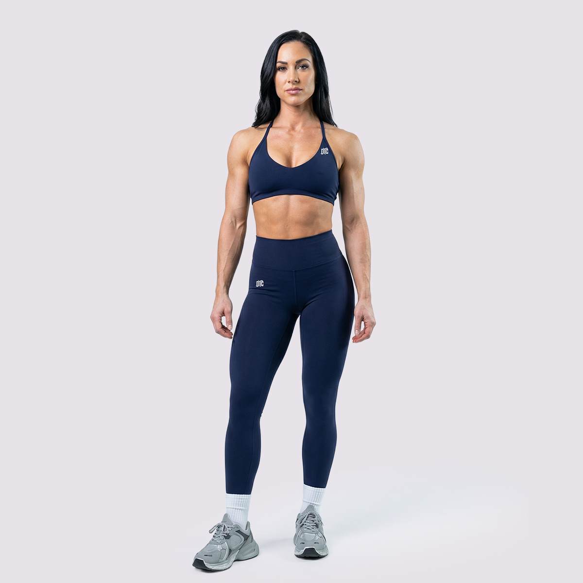 Seamless performance leggings and matching bra in navy, full front view
